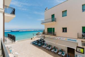a view of the beach from the balcony of a hotel at Casa vacanze Afrodite nel centro storico in Otranto