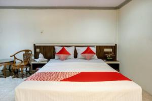 Postel nebo postele na pokoji v ubytování OYO 2972 Wisma Sartika
