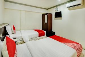 Postel nebo postele na pokoji v ubytování OYO 2972 Wisma Sartika