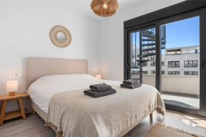 Ένα ή περισσότερα κρεβάτια σε δωμάτιο στο Luxury penthouse with beautiful rooftop at top location