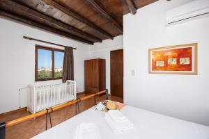 Postel nebo postele na pokoji v ubytování Villa Tzina