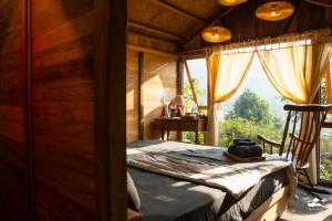 Postel nebo postele na pokoji v ubytování Xieng Retreat