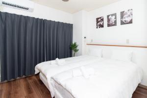 Postel nebo postele na pokoji v ubytování Stay kobe