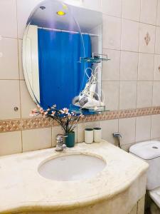 a bathroom with a sink and a mirror at Seaview unit in Manila
