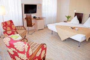 TV a/nebo společenská místnost v ubytování Appartementhaus Sellin