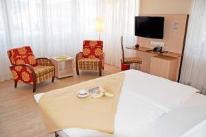 TV a/nebo společenská místnost v ubytování Appartementhaus Sellin