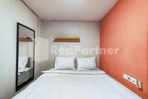 Postel nebo postele na pokoji v ubytování Audah Guesthouse Syariah RedPartner
