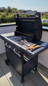 a barbecue grill sitting on top of a table at Villa Au Rythme Des Marées in Carantec