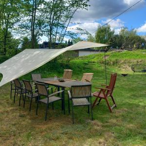 a table and chairs under a tent in a yard at Villa Sommersted Andersen in Sommersted