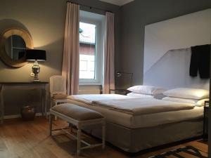 Postel nebo postele na pokoji v ubytování Strandhotel Margaretha