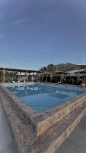 a large swimming pool in the middle of a building at LA Casa Di Lusso Casa N2 Adults Only in Kolimbia +20 photos