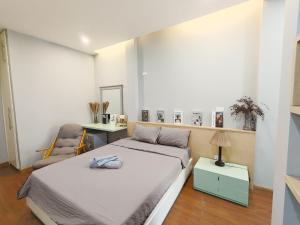 Postel nebo postele na pokoji v ubytování Jasmine Homestay