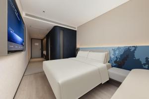Postel nebo postele na pokoji v ubytování Atour Light Hotel Beijing International Trade Center Chaoyang Heshenghui