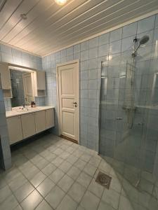 a bathroom with a shower and a sink at Faleide Grandview in Stryn