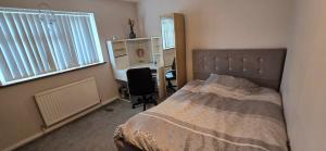 Postel nebo postele na pokoji v ubytování Homely Home
