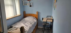Postel nebo postele na pokoji v ubytování Homely Home
