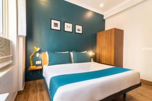 Postel nebo postele na pokoji v ubytování Hotel Max Marina Delhi Airport