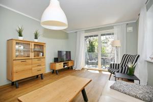 TV a/nebo společenská místnost v ubytování Hermannstraße 16a Wohnung Seestern