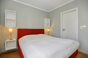 Postel nebo postele na pokoji v ubytování Hermannstraße 16a Wohnung Seestern