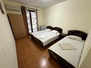 Postel nebo postele na pokoji v ubytování Guesthouse Apartments