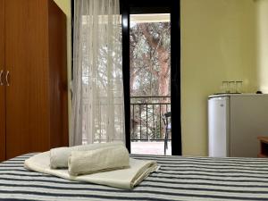 Postel nebo postele na pokoji v ubytování Guesthouse Apartments