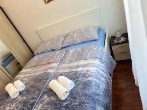 En eller flere senge i et værelse på Apartments Mauro + 101 billeder