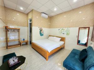 Postel nebo postele na pokoji v ubytování Garden House Nha Trang Homestay - Venuestay + 35 fotografií