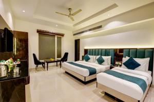 Katil atau katil-katil dalam bilik di Hotel Krishna - By RCG Hotels, Centrally Located, New Delhi