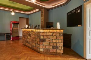 a brick counter in a room with a soda machine at B3 Hostel Budapest in Budapest