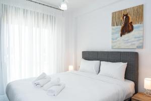 Voodi või voodid majutusasutuse Olympiada Residential Complex & Villas toas