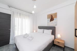 Voodi või voodid majutusasutuse Olympiada Residential Complex & Villas toas