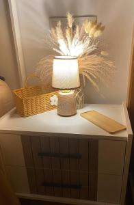 a table with a lamp and a basket on it at Condado de Alhama Jardin 11 SV51 in Alhama de Murcia +17 photos