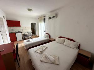 Postel nebo postele na pokoji v ubytování Guesthouse Apartments