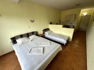 Postel nebo postele na pokoji v ubytování Guesthouse Apartments