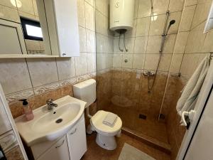 Koupelna v ubytování Guesthouse Apartments