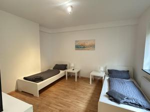 Postel nebo postele na pokoji v ubytování Unterkunft bei Lübeck - Zentral an der A1 - Parkplatz - Terrasse