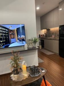 a kitchen with a large fish tank on the wall at Lustay StudioH3 Hawaii Masteri- Luxury Furnished in Gia Lâm Pho +10 photos