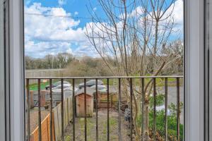 a view from a window of a yard at Spacious 4 Bed Preston Home with Garden & Parking in Preston +22 photos