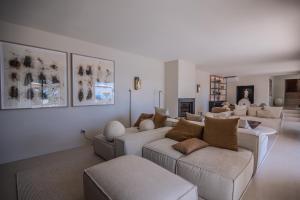 a living room with two couches and a couch at Azuréenne de la Nartelle in Sainte-Maxime
