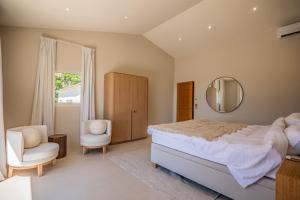 a bedroom with a large bed and a mirror at Azuréenne de la Nartelle in Sainte-Maxime +54 photos