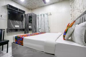 Postel nebo postele na pokoji v ubytování FabHotel Hans Residency + 23 fotografií