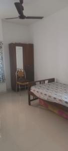 Ένα ή περισσότερα κρεβάτια σε δωμάτιο στο Fort Nagar Home