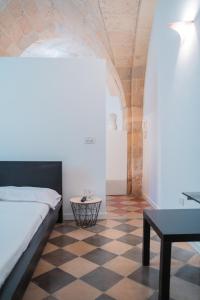 Ένα ή περισσότερα κρεβάτια σε δωμάτιο στο Don Rocco Historic Stay