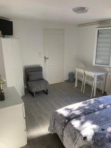Χώρος καθιστικού στο Chambre comme un petit logement