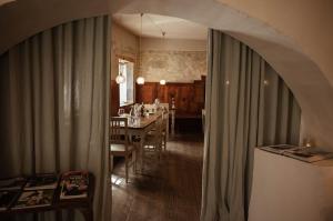 a kitchen and dining room with a table and a dining room at 1477 Reichhalter, a Member of Design Hotels in Lana