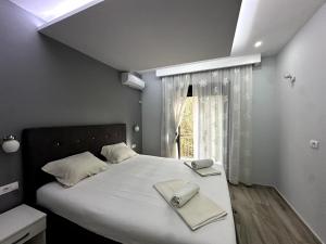Postel nebo postele na pokoji v ubytování Guesthouse Apartments