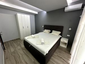 Postel nebo postele na pokoji v ubytování Guesthouse Apartments