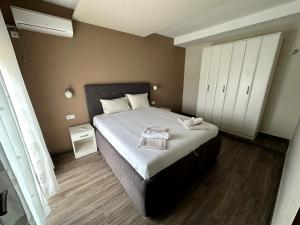 Postel nebo postele na pokoji v ubytování Guesthouse Apartments