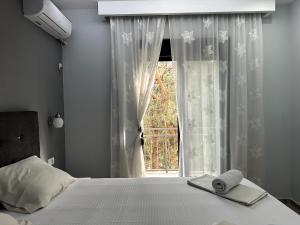 Postel nebo postele na pokoji v ubytování Guesthouse Apartments
