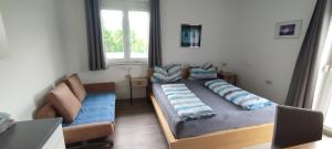 Postel nebo postele na pokoji v ubytování Helis Gästezimmer